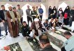 غبارروبی و عطرافشانی گلزار شهدای گمنام حاجی‌آباد